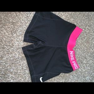 Black and pink NIKE PRO shorts